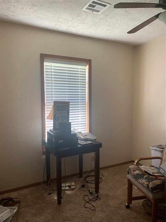 845 N Washington Ave, Mountain View, OK 73062 - office space featuring ceiling fan, a textured ceiling, baseboards, and carpet floors