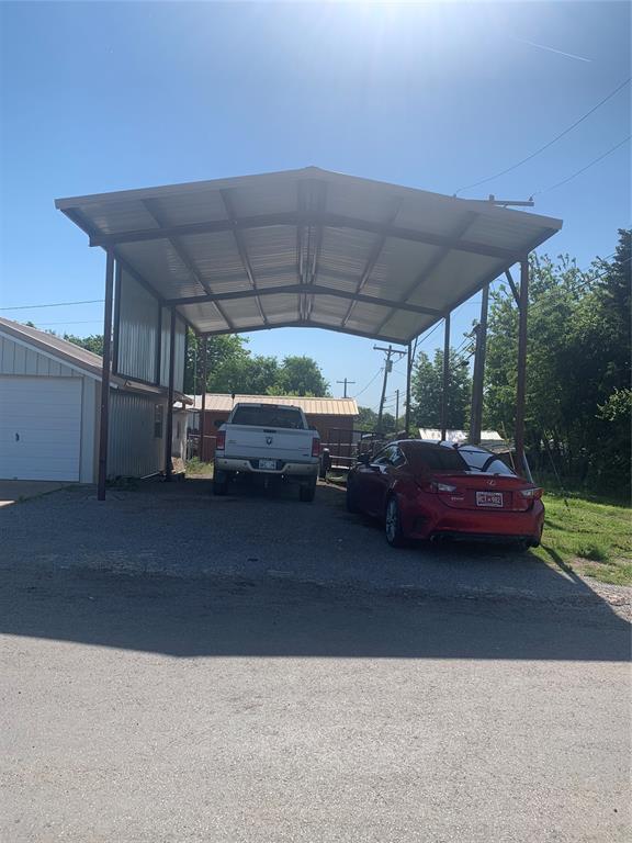 845 N Washington Ave, Mountain View, OK 73062 - view of parking / parking lot featuring asphalt driveway and a detached carport