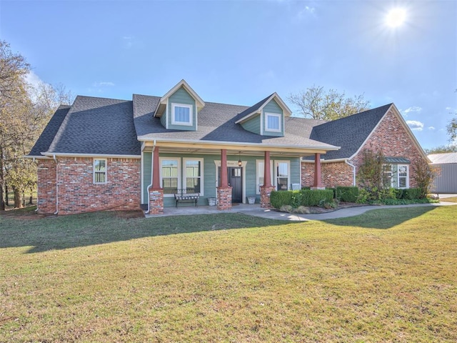 24051 Hester Cir, Washington, OK 73093 - view of front of property featuring a front yard, brick siding, and a shingled roof