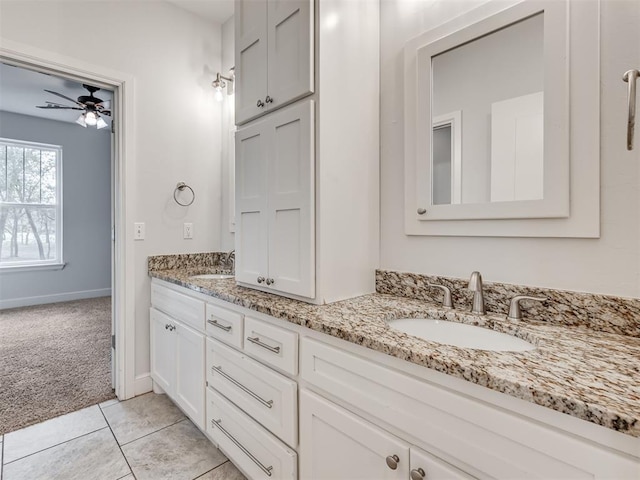 24051 Hester Cir, Washington, OK 73093 - full bathroom featuring double vanity, a ceiling fan, baseboards, and tile patterned floors