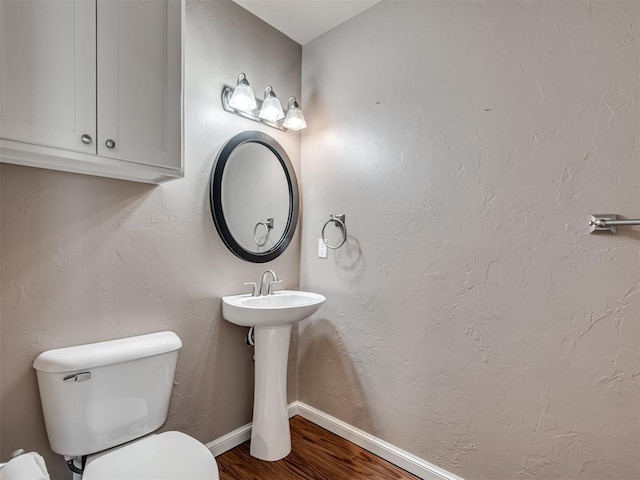 24051 Hester Cir, Washington, OK 73093 - bathroom with wood finished floors, toilet, and baseboards