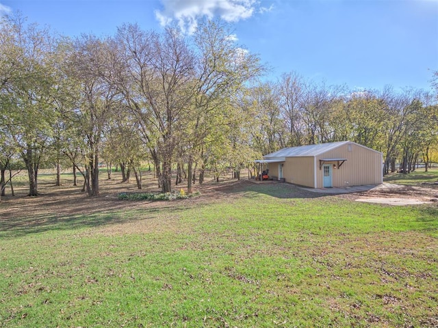 24051 Hester Cir, Washington, OK 73093 - view of green lawn featuring an outbuilding
