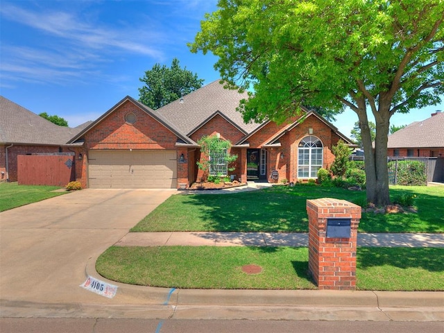 4105 Nailon Dr, Norman, OK 73072 - view of front of property featuring brick siding, a garage, and driveway
