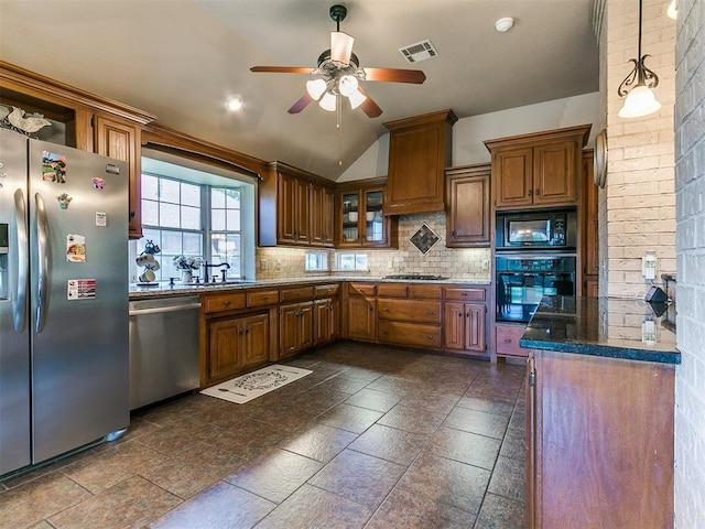 4105 Nailon Dr, Norman, OK 73072 - kitchen with black appliances, ceiling fan, brown cabinets, backsplash, and lofted ceiling