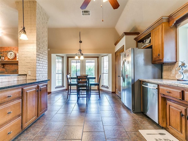 4105 Nailon Dr, Norman, OK 73072 - kitchen featuring stainless steel dishwasher, brown cabinets, a ceiling fan, lofted ceiling, and decorative light fixtures