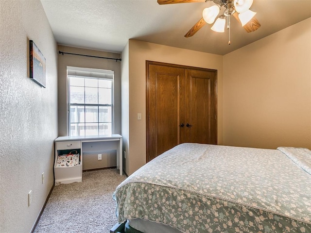 4105 Nailon Dr, Norman, OK 73072 - bedroom with carpet, a closet, a ceiling fan, and a textured wall