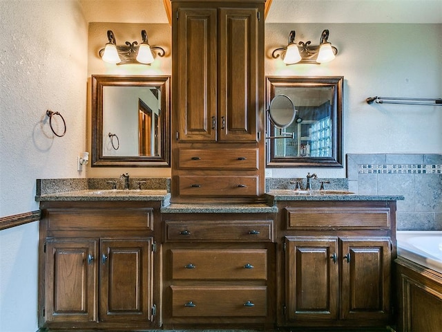 4105 Nailon Dr, Norman, OK 73072 - bathroom featuring vanity, a tub to relax in, and a textured wall