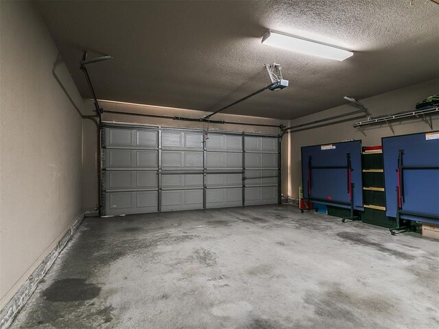 4105 Nailon Dr, Norman, OK 73072 - garage with a garage door opener and baseboards