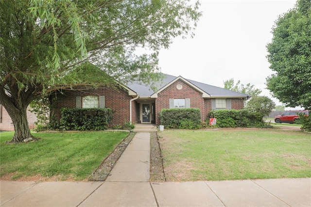 717 Vickery Ave, Yukon, OK 73099 - ranch-style house with brick siding and a front yard