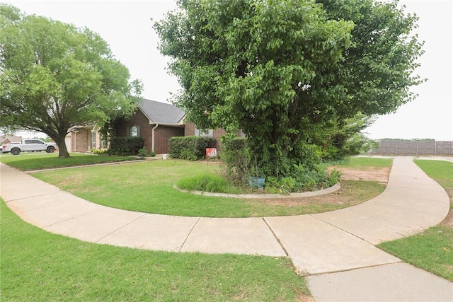 717 Vickery Ave, Yukon, OK 73099 - view of side of property featuring brick siding