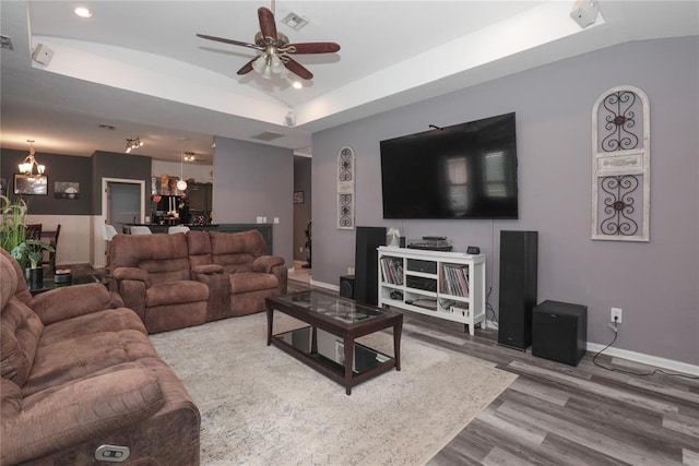 717 Vickery Ave, Yukon, OK 73099 - living room featuring ceiling fan, wood finished floors, recessed lighting, baseboards, and a raised ceiling