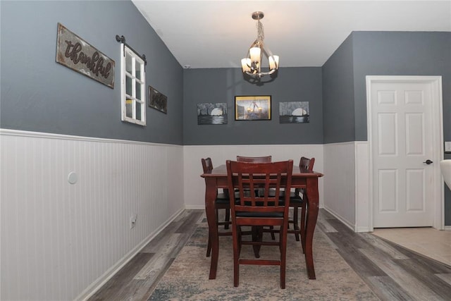 717 Vickery Ave, Yukon, OK 73099 - dining space with wood finished floors, a chandelier, and a wainscoted wall