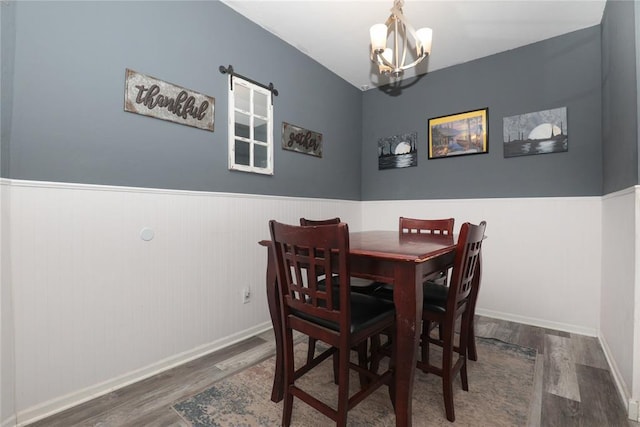 717 Vickery Ave, Yukon, OK 73099 - dining area with wood finished floors, a chandelier, wainscoting, and baseboards