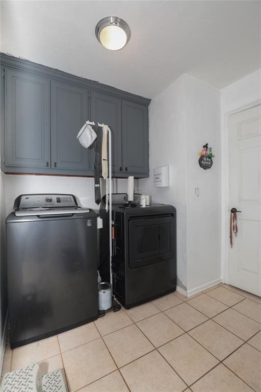 717 Vickery Ave, Yukon, OK 73099 - washroom with independent washer and dryer, cabinet space, light tile patterned floors, and baseboards