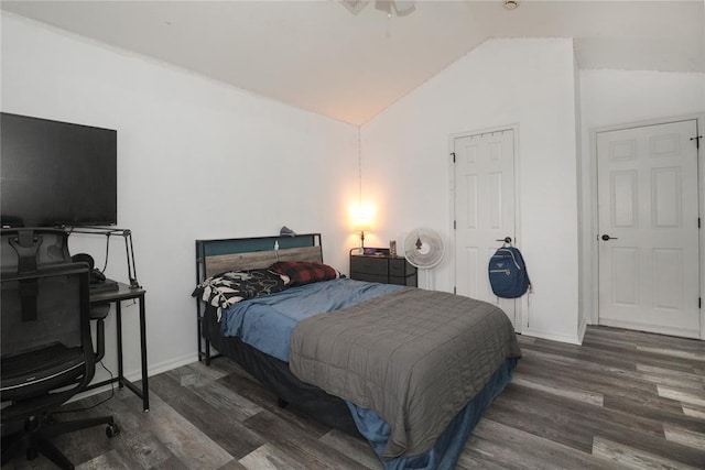 717 Vickery Ave, Yukon, OK 73099 - bedroom with lofted ceiling, wood finished floors, and baseboards