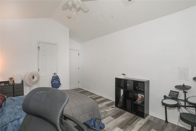 717 Vickery Ave, Yukon, OK 73099 - bedroom with wood finished floors, vaulted ceiling, baseboards, and a ceiling fan