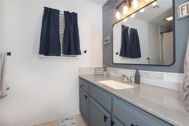 717 Vickery Ave, Yukon, OK 73099 - bathroom featuring vanity, baseboards, and tile patterned floors