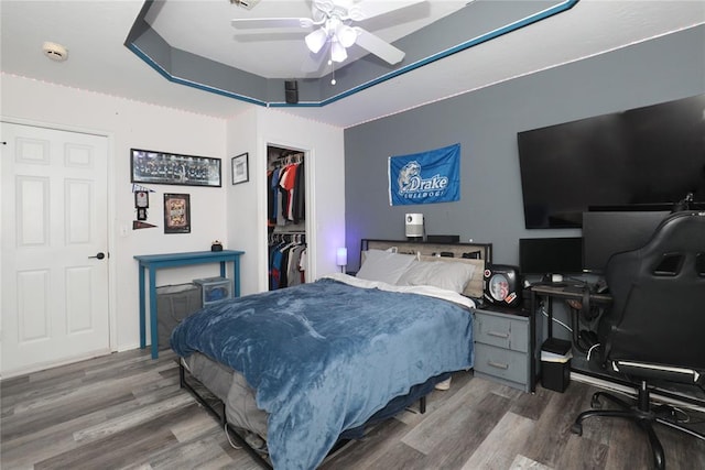 717 Vickery Ave, Yukon, OK 73099 - bedroom featuring wood finished floors, a desk, a closet, and a spacious closet