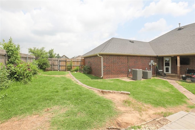 717 Vickery Ave, Yukon, OK 73099 - view of yard with central AC and a patio