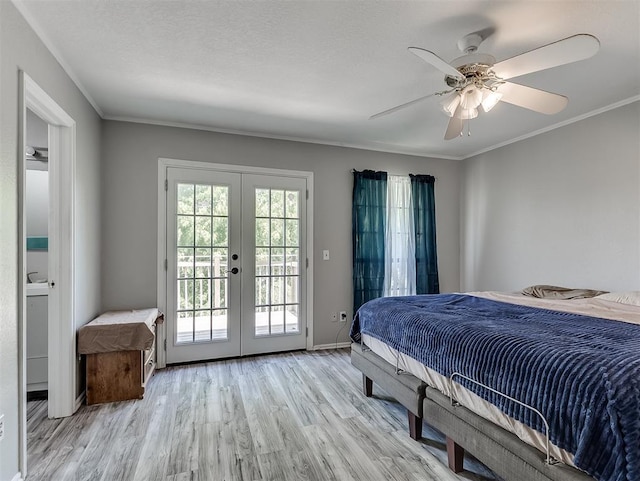 2101 NE 11th St, Moore, OK 73160 - bedroom with access to exterior, french doors, light wood-style floors, ceiling fan, and crown molding