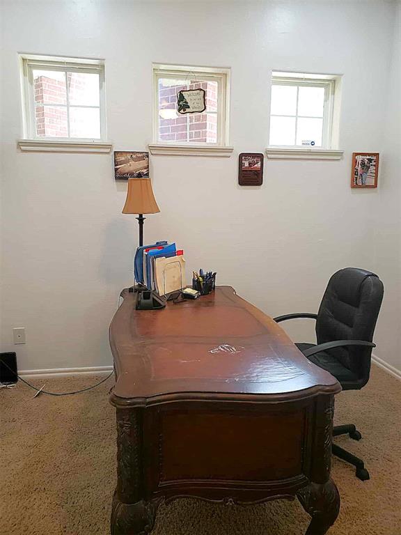 7336 E 136th Rd, Holdenville, OK 74848 - home office featuring carpet flooring and baseboards