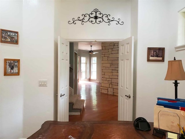 7336 E 136th Rd, Holdenville, OK 74848 - hallway featuring wood finished floors and a towering ceiling