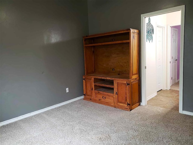 7336 E 136th Rd, Holdenville, OK 74848 - unfurnished living room featuring light carpet and baseboards