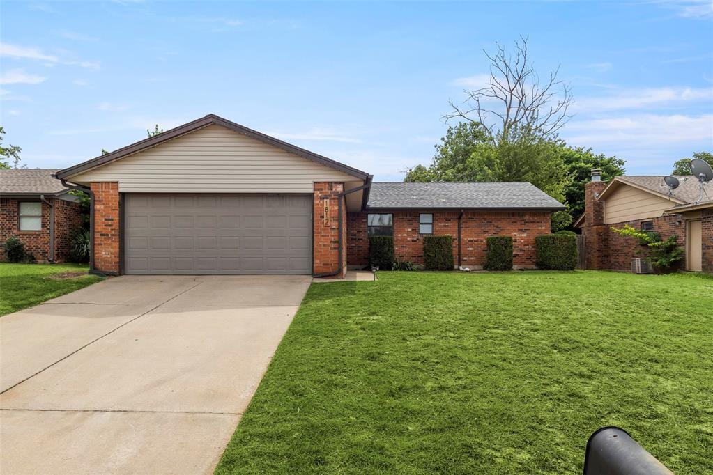 1812 David Ter, Oklahoma City, OK 73141 - ranch-style house featuring an attached garage, driveway, and a front lawn