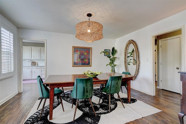 3104 NW 21st St, Oklahoma City, OK 73107 - dining space featuring dark wood-type flooring and baseboards
