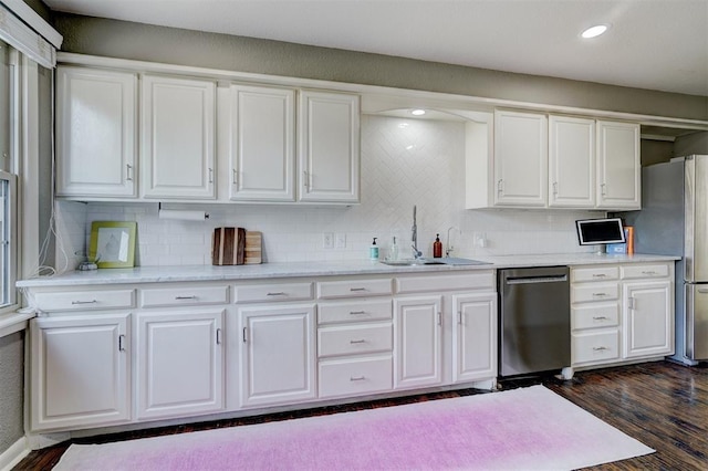 3104 NW 21st St, Oklahoma City, OK 73107 - kitchen featuring appliances with stainless steel finishes, white cabinets, decorative backsplash, and recessed lighting