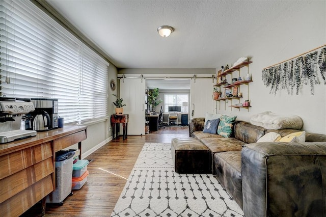 3104 NW 21st St, Oklahoma City, OK 73107 - living room featuring wood finished floors and a textured ceiling