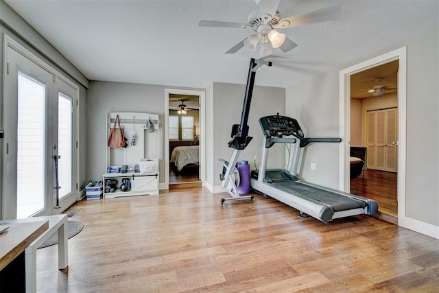 3104 NW 21st St, Oklahoma City, OK 73107 - exercise area featuring a ceiling fan, light wood-type flooring, and a textured ceiling