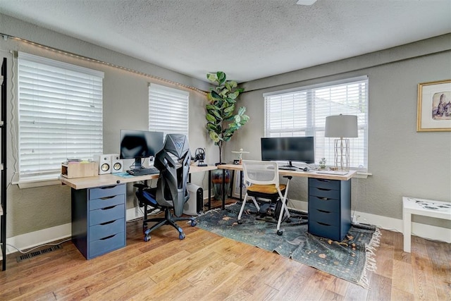 3104 NW 21st St, Oklahoma City, OK 73107 - office area with wood finished floors and a textured ceiling
