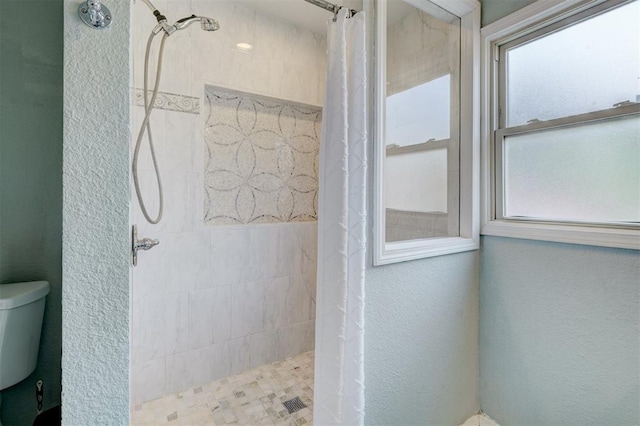 3104 NW 21st St, Oklahoma City, OK 73107 - bathroom with a tile shower and a textured wall