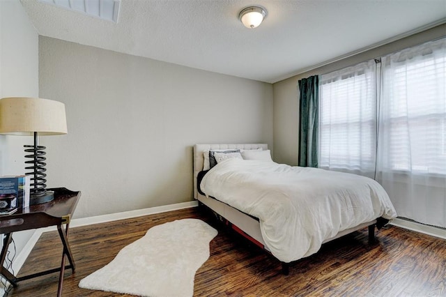 3104 NW 21st St, Oklahoma City, OK 73107 - bedroom featuring wood finished floors and a textured ceiling