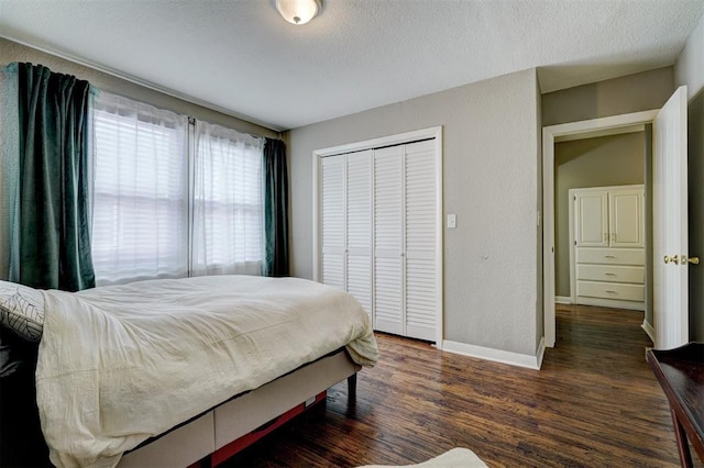 3104 NW 21st St, Oklahoma City, OK 73107 - bedroom with wood finished floors, a closet, and a textured ceiling