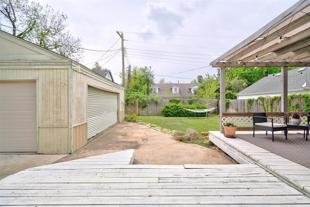3104 NW 21st St, Oklahoma City, OK 73107 - wooden terrace featuring an outbuilding and a detached garage