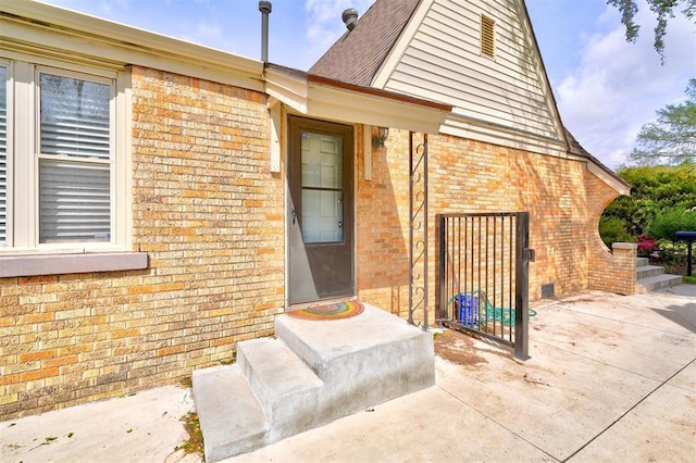 3104 NW 21st St, Oklahoma City, OK 73107 - doorway to property featuring brick siding
