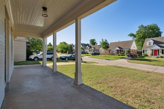 2321 NW 25th St, Oklahoma City, OK 73107 - porch featuring a residential view and a lawn