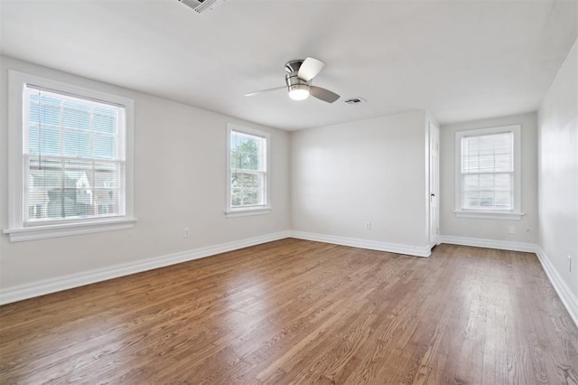 2321 NW 25th St, Oklahoma City, OK 73107 - empty room featuring wood finished floors, baseboards, and ceiling fan