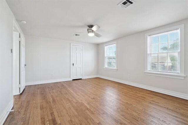 2321 NW 25th St, Oklahoma City, OK 73107 - unfurnished bedroom featuring wood finished floors, baseboards, and a ceiling fan