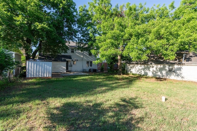 2321 NW 25th St, Oklahoma City, OK 73107 - view of green lawn with central AC unit and a water view