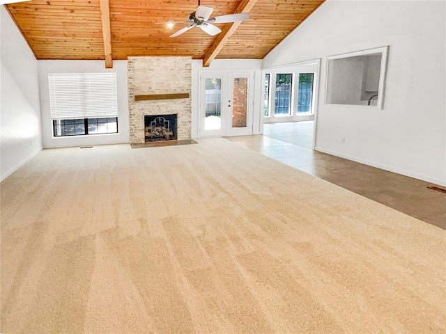unfurnished living room with wooden ceiling, a ceiling fan, baseboards, carpet flooring, and high vaulted ceiling
