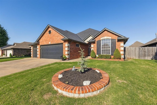 2825 Busheywood Dr, Yukon, OK 73099 - view of front facade featuring brick siding, an attached garage, and concrete driveway