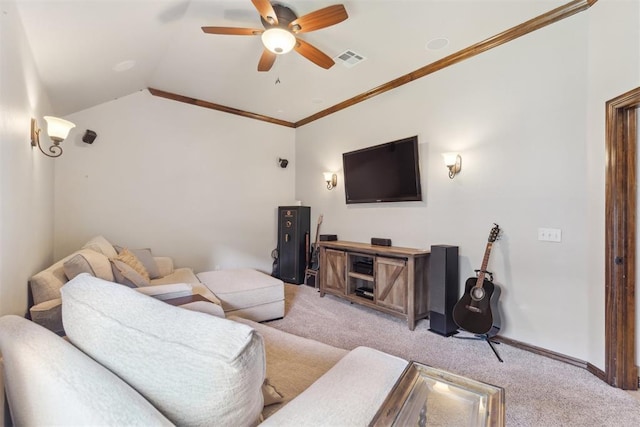 2825 Busheywood Dr, Yukon, OK 73099 - living room with light carpet, a ceiling fan, vaulted ceiling, ornamental molding, and baseboards