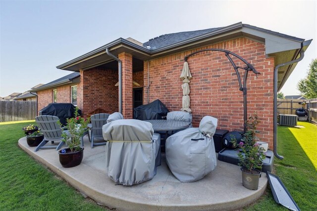 2825 Busheywood Dr, Yukon, OK 73099 - view of patio / terrace featuring central AC and a grill
