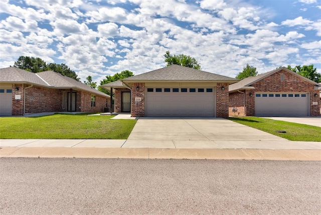 316 SW 4th Pl, Newcastle, OK 73065 - view of front of property featuring a front yard, a garage, driveway, and brick siding