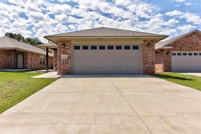 316 SW 4th Pl, Newcastle, OK 73065 - ranch-style house with concrete driveway, a front yard, brick siding, and a garage