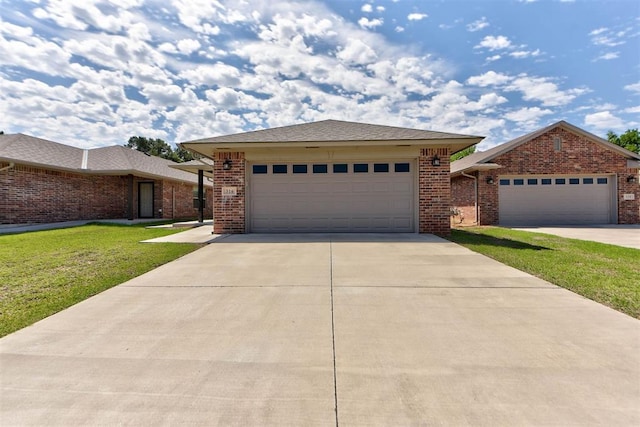 316 SW 4th Pl, Newcastle, OK 73065 - view of front of home featuring a front lawn, a garage, brick siding, and concrete driveway