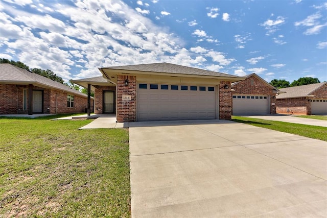 316 SW 4th Pl, Newcastle, OK 73065 - view of front of property with a garage, driveway, a front yard, and brick siding